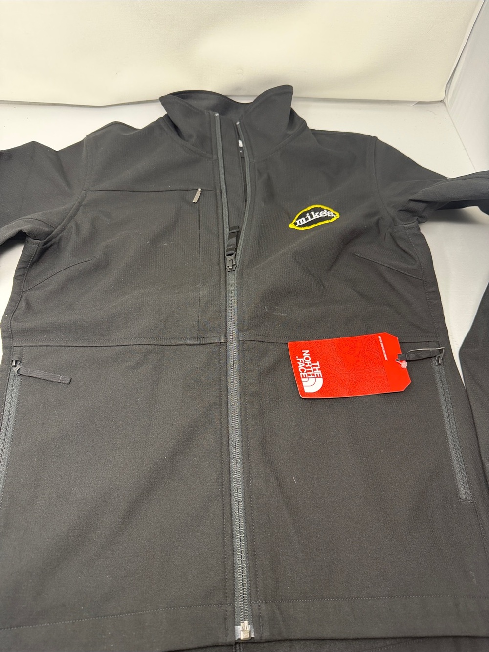The North Face Black Lightweight Softshell Jacket with Yellow Mike's Logo women